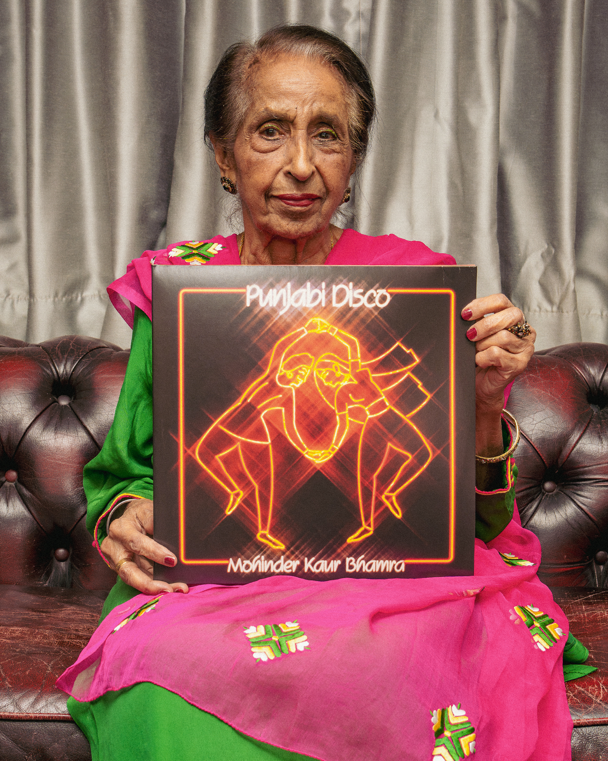 Mohinder Kaur Bhamra holding Punjabi Disco on vinyl